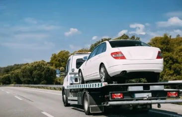Car being recovered on a tow truck